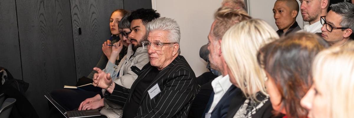 Attendee asking a question with other listening at MedTech: Melbourne's Growing Sector event